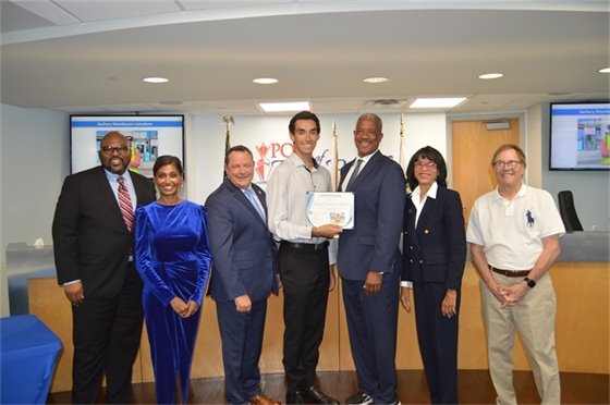 Port Commissioners, Executive Director Michael Meekins and Communications and Ozinga intern Zachary-Nisenbaum Lamadore.