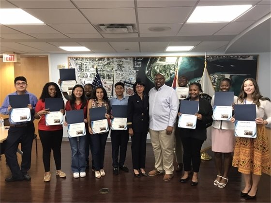 Port Commissioners Dr. Jean L. Enright, Dr. Deandre Poole and interns 