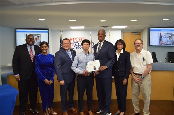 Port Commissioners, Executive Director Michael Meekins and Communications and Finance intern Zephaniahn Torres.