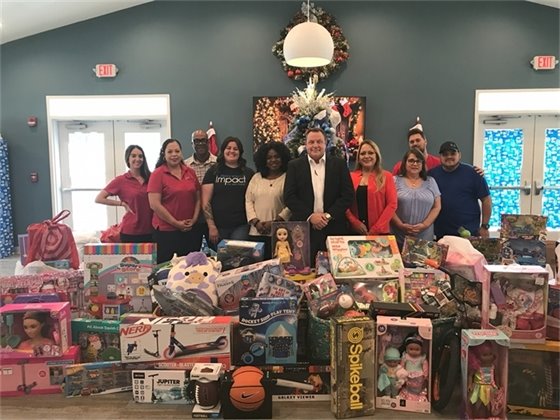 Port staff delivering toys to Azues Estates