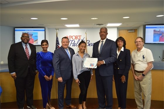 Commissioners, Executive Director Michael Meekins and Communications and HR intern Amber Macariola