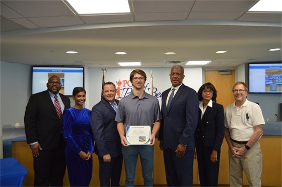 Port Commissioners, Executive Director Michael Meekins and IT intern Pierce Read.