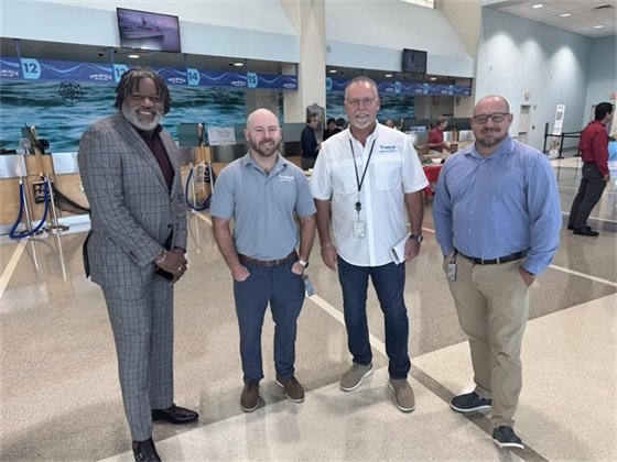 Port staff Phil Ford and Keith Leggett with the Tropical Shipping team