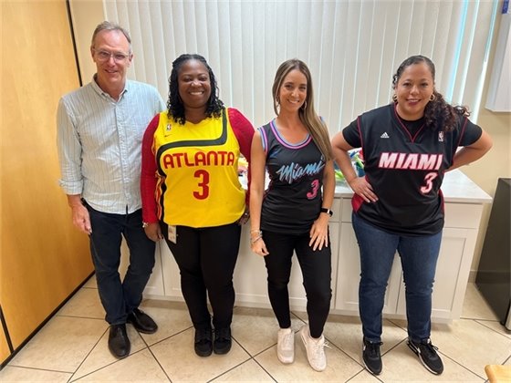 Employees celebrating March Madness