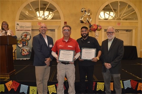 Security Sgt. Jeff Farr and South Florida Materials employee Oscar Garcia