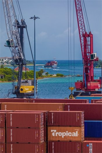 Tropical Shipping vessel navigating the inlet