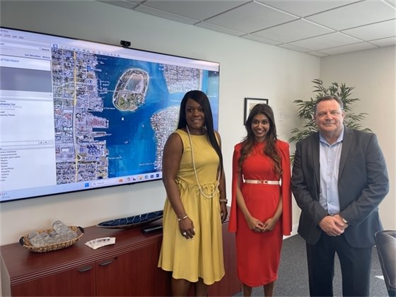 Charisma Adams, Commissioner Varisa Lall Dass, and ED Michael Meekins