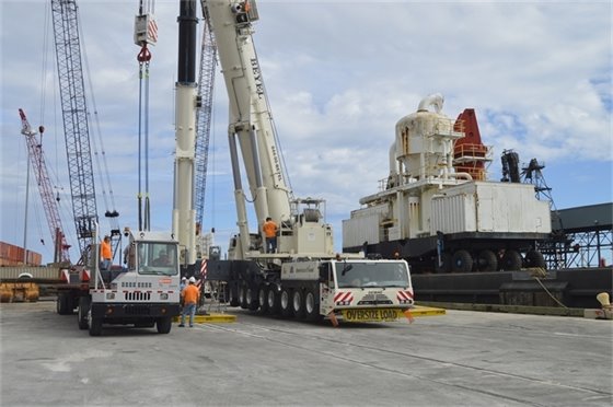 cement unloader and two cranes used to off load the equipment