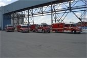 Ambulances and fire trucks lined up on the dock
