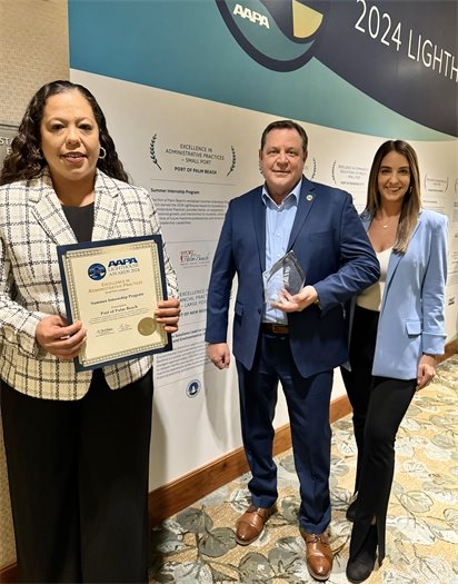 HR Manager Raquel Rivera, ED Michael Meekins and PIO Yaremi Farinas