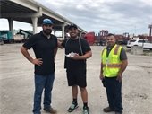 CEMEX employees with Tropical Shipping truck driver