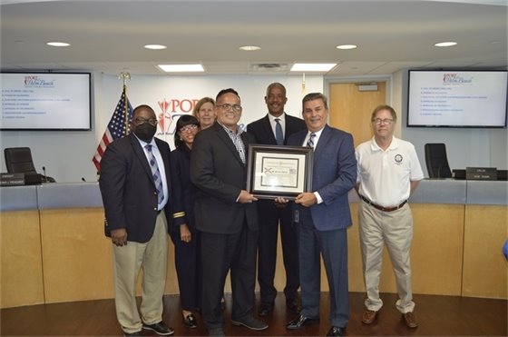 Port Director Manuel Almira pictured alongside commissioners and Sam Roman with the Florida Hispanic American Chamber of Commerce