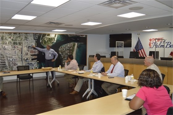 Port Executive Dircetor Manuel Almira shows the group the area in the inlet that experiences the most shoaling. 