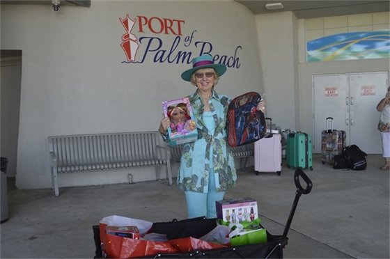 Lee Innocenti donating gifts donated by her neighbors at Palm Beach Marriott Singer Island 