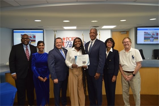 Port Commissioners, Executive Director Michael Meekins and Communications and HR intern Nyha Shannon.