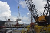 Crane loading reef onto barge