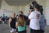 WPBF reporter interviewing cruise passengers 