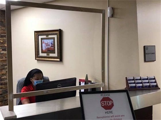 Plexiglass installed at reception desk