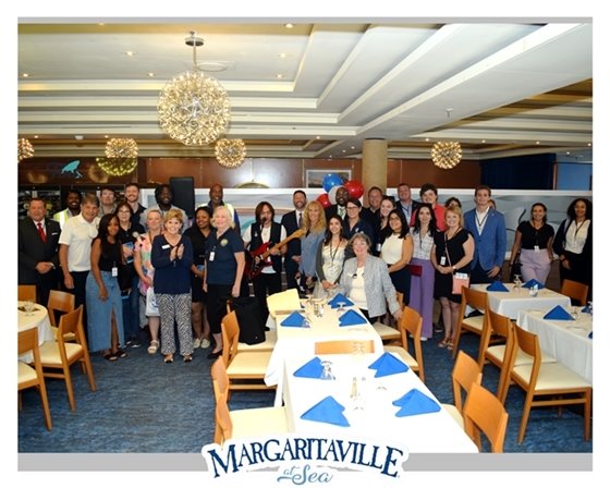 Group Photo at Fins Dining on Margaritaville at Sea Parardise