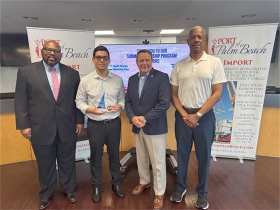 Commissioner Dr. Deandre Poole, Wayne Richards, Executive Director Michael Meekins and Fabricio Cordova with Florida Sugar and Molasses Exchange, Inc. 