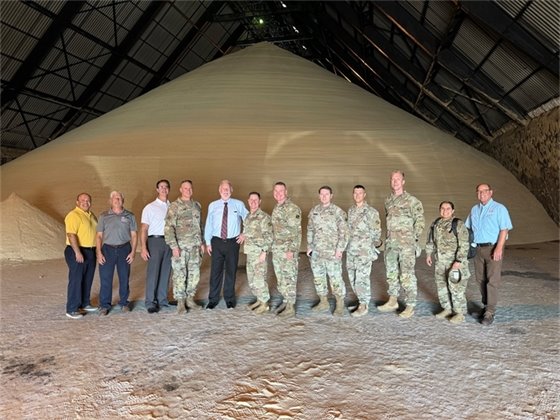 Army Corps representatives at raw sugar warehouse