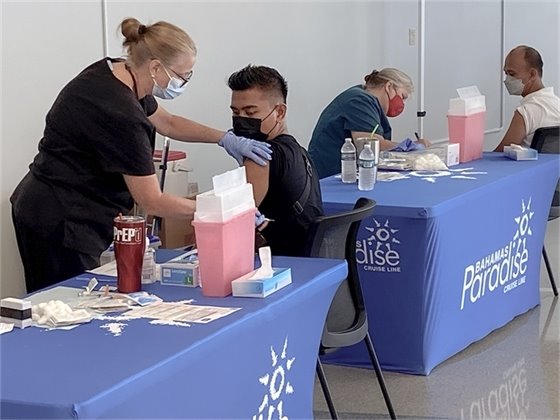 Crew member being vaccinated