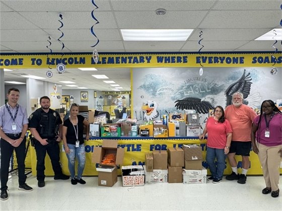 Heavy Lift Services President Glen Dias, VP Tina Dias, summer interns and Lincoln representatives