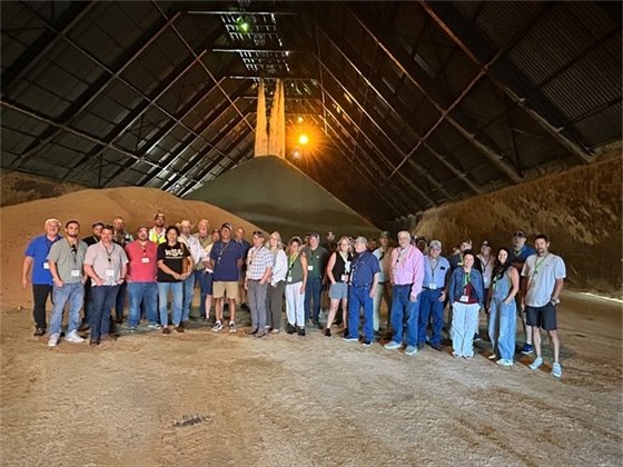 Group at sugar warehouse