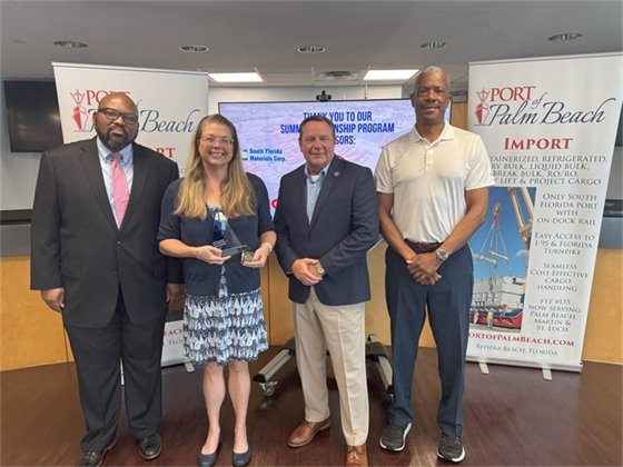 Commissioner Dr. Deandre Poole, Wayne Richards, Executive Director Michael Meekins and Tropical Shipping's Marketing Manager Liza Suder 