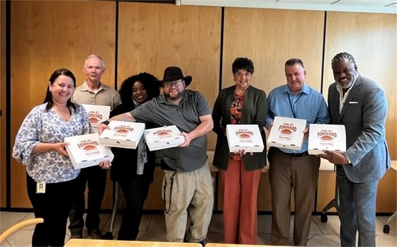 Staff receiving pies