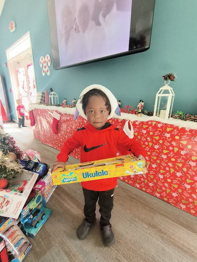 Azure Estates child receives gift